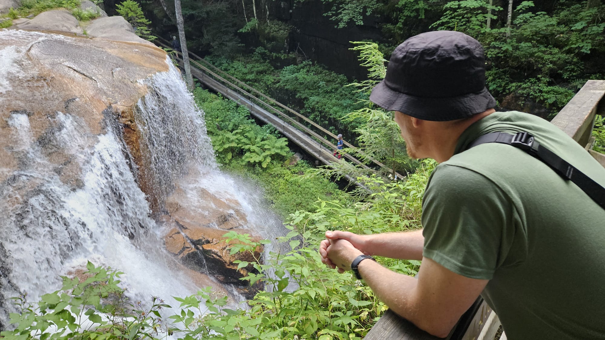 The page author from the back looking at a waterfall.